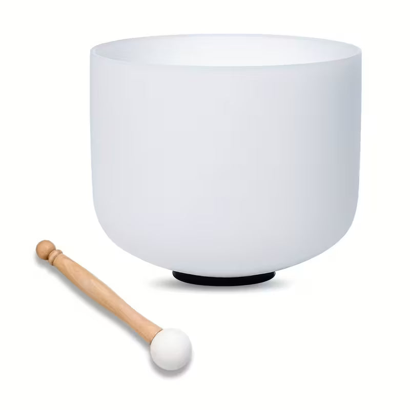 White singing bowl with a wooden mallet on a white background