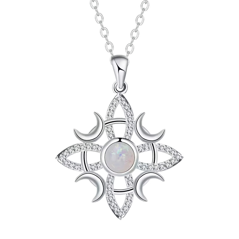Sterling silver witch’s knot necklace with moon phase design, opal center stone, and celestial Celtic-inspired pendant on silver chain.